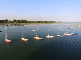 Sailboats moored on calm water near a grassy shoreline at Cape 12 Near Yarmouth
