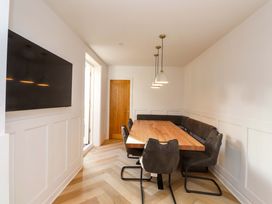 A dining room with a table and chairs at 5 Lombard Street in Porthmadog