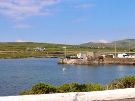 A view of a pier with boats at O'Conells in Portmagee