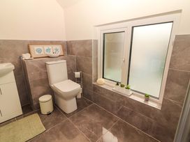 A bathroom with a toilet and sink at O'Connell's Lodge, Portmagee, County Kerry