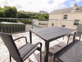 An outdoor area with a table and chairs at O'Connell's Lodge, Portmagee, County Kerry
