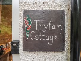 A sign displaying Tryfan Cottage located at Tryfan Cottage in Nant Gwynant