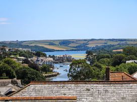 A view of a river and boats with houses and hills in the background at 61B Fore Street in Kingsbridge
