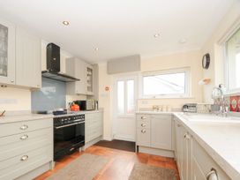 A kitchen with cabinets and a sink at Chimings in Rock