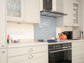 A kitchen with an oven and microwave at Chimings in Rock