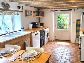 A kitchen with a sink and appliances at Picket Mead Southleigh near Colyton