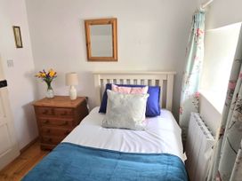 A bedroom with a bed and bedside table at Picket Mead Southleigh near Colyton