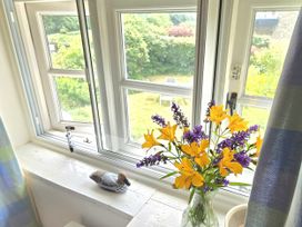 A window with flowers in a vase at Picket Mead Southleigh near Colyton