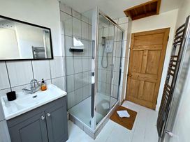 A bathroom with a shower and sink at Picket Mead Southleigh near Colyton