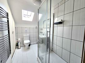 A bathroom with a shower and toilet at Picket Mead Southleigh near Colyton