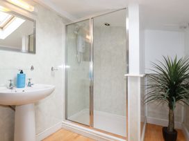 A bathroom with a shower and sink at Nanvivian Feock near Truro