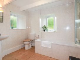 A bathroom with a sink, toilet, and bathtub at Nanvivian in Feock near Truro