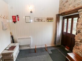 An entrance area with hooks and a radiator at 8 Rogeston Cottages Haverfordwest