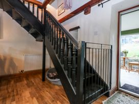 An entryway with stairs and a doorway at Pen Glorian in Conwy