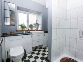 A bathroom with a shower and sink at Pen Glorian in Conwy