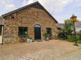 An outdoor view of a stone building entrance at Pen Glorian in Conwy