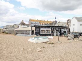 An outdoor café with boats on gravel at Flat 13, Chesil House in Bridport