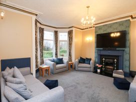 A living room with a sofa and television at Kingfisher House Saltburn-by-the-Sea