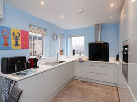 A kitchen with a sink and coffee machine at Kingfisher House in Saltburn-by-the-Sea