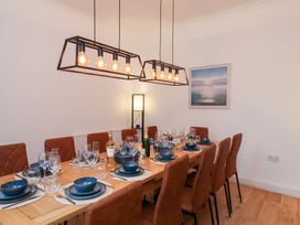 A dining room with a table set for dinner at Kingfisher House Saltburn-by-the-Sea