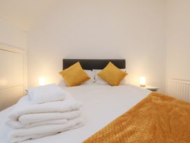 A bedroom with a bed and pillows at Kingfisher House Saltburn-by-the-Sea
