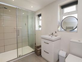 A bathroom with shower and sink at St Gregory’s Cottage Oswaldkirk near Helmsley