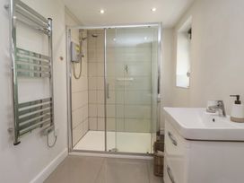 A bathroom with a shower and sink at St Gregory’s Cottage Oswaldkirk near Helmsley