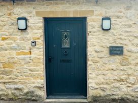 A front door with a nameplate at St Gregory's Cottage Oswaldkirk near Helmsley