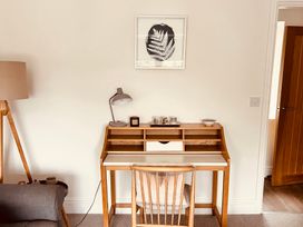 An office with a desk and lamp at St Gregory’s Cottage in Oswaldkirk near Helmsley