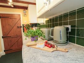 A kitchen with utensils on a countertop at Spring Cottage in York
