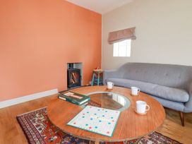 A living room with a sofa and coffee table at The Wedge in Mitchell near Summercourt