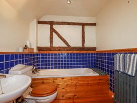 A bathroom with a sink, toilet, and a bathtub at The Wedge in Mitchell near Summercourt