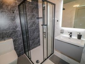 A bathroom with a shower enclosure toilet and sink at Number 2 Dome in Derrybeg County Donegal