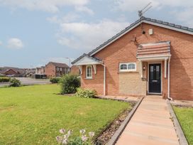 A house exterior with a pathway and garden at 3 Hawk Place, Moresby Parks near Whitehaven
