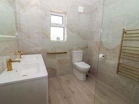 A bathroom with a sink and toilet at Teach Ti in Miltown Malbay