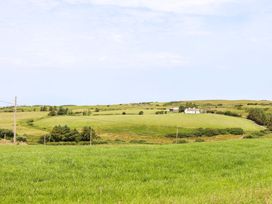 A house surrounded by grassy fields at Teach Ti in Miltown Malbay