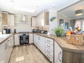 A kitchen with modern appliances at Life's a Beach Bacton