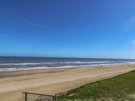 A beach with sand and ocean at Life's a Beach in Bacton