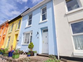A blue house with a white door and plants at 45 North View in Brixham
