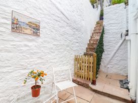 An outdoor area with stairs and a potted plant at 45 North View in Brixham