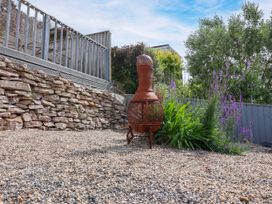 A garden with a chiminea and gravel at 45 North View in Brixham