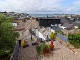 A view of houses with the sea in the background at 45 North View Brixham