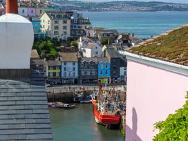 A harbor area with boats and buildings at 45 North View in Brixham