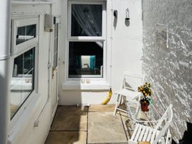 An outdoor space with chairs and a table at 45 North View in Brixham