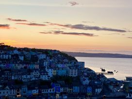 A view of colorful houses by the water at 45 North View in Brixham