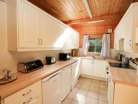A kitchen with cabinets, sink, and appliances at Pen Y Clawdd Beggar's Bush near Presteigne