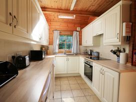 A kitchen with cabinets and appliances at Pen Y Clawdd Beggar's Bush near Presteigne