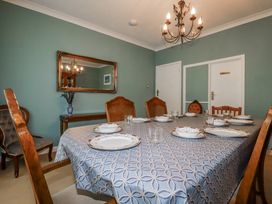 A dining room with a table set for dinner at Pipers in Newquay