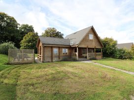 A wooden house with a garden at Dan Y Coed Beggar's Bush near Presteigne