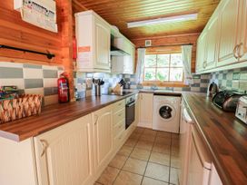 A kitchen with appliances and wooden countertops at Dan Y Coed near Beggar's Bush near Presteigne